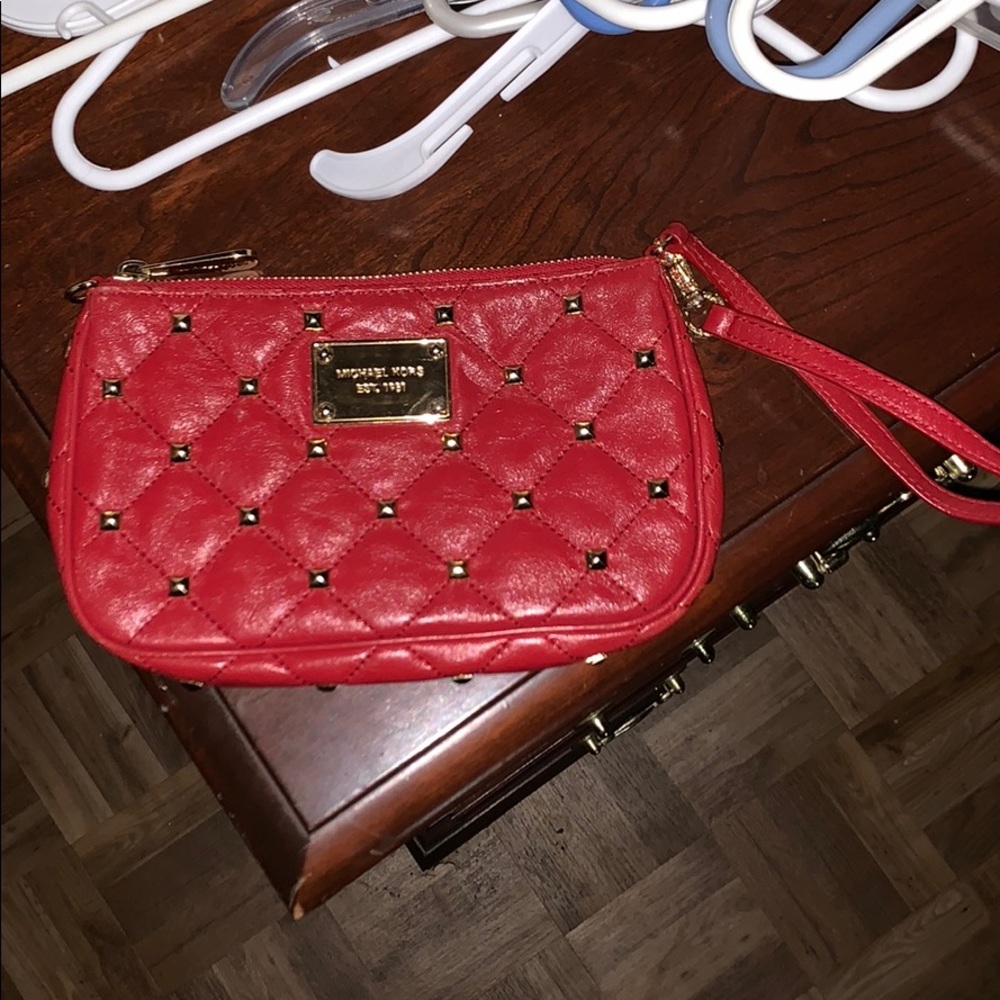 Red Michael Kors clutch with gold studs